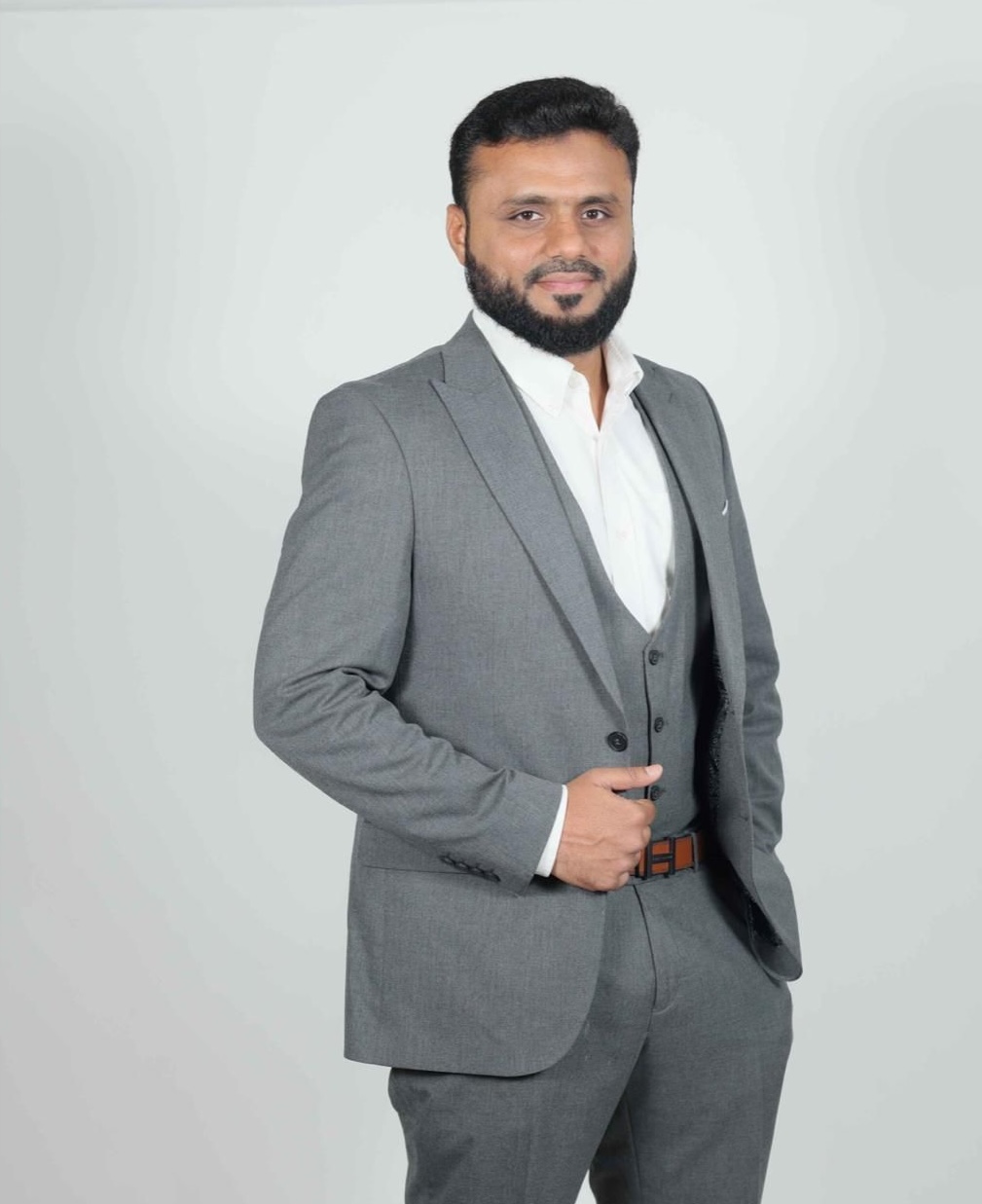Professional portrait of Fazil Rahman, Chairman and business leader in luxury jewelry, gold, and real estate